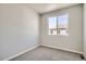 Bright bedroom featuring carpet and a large window at 446 Millwall Cir, Castle Pines, CO 80108