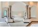 Spacious main bedroom with large windows and ornate columns at 26600 Mowbray Ct, Evergreen, CO 80439