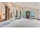 Bright and airy living room with high ceilings, fireplace, and access to balcony at 26600 Mowbray Ct, Evergreen, CO 80439