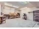 A well-equipped workshop with workbench, shelving, and various tools at 26600 Mowbray Ct, Evergreen, CO 80439