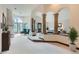 Main bedroom with sitting area, fireplace, and views from large windows at 26600 Mowbray Ct, Evergreen, CO 80439