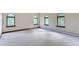 Bright bedroom with arched windows and hardwood floors at 26600 Mowbray Ct, Evergreen, CO 80439