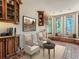 Cozy reading room with built-in window seat and hardwood floors at 26600 Mowbray Ct, Evergreen, CO 80439