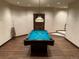 Finished basement with a game room and pool table at 26600 Mowbray Ct, Evergreen, CO 80439