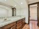 Elegant bathroom with double vanity and tiled floors at 26600 Mowbray Ct, Evergreen, CO 80439