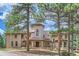 Two-story house with a grand entrance and landscaping at 26600 Mowbray Ct, Evergreen, CO 80439