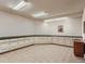 Bright, spacious basement workshop featuring ample storage and built-in cabinetry at 26600 Mowbray Ct, Evergreen, CO 80439