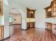 Breakfast nook with built-in wooden cabinetry and terracotta tile floors at 26600 Mowbray Ct, Evergreen, CO 80439