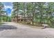 Long driveway leading to a stunning two-story house at 26600 Mowbray Ct, Evergreen, CO 80439