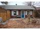 Brick building and patio in a backyard setting with autumn leaves at 3610 N Clay St, Denver, CO 80211