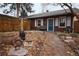 Brick building with blue door and stone patio at 3610 N Clay St, Denver, CO 80211