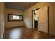 Simple bedroom with hardwood floors and an open door to the kitchen at 3610 N Clay St, Denver, CO 80211