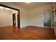 Hardwood floors and an ensuite bathroom in the main bedroom at 3610 N Clay St, Denver, CO 80211