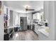 Modern kitchen with stainless steel appliances and white cabinets at 2371 Locust St, Denver, CO 80207