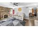 Spacious living room with a stone fireplace and hardwood floors at 2371 Locust St, Denver, CO 80207