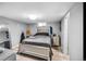 Cozy finished basement bedroom with a double bed and mirrored dresser at 2371 Locust St, Denver, CO 80207