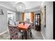 Charming dining room with hardwood floors and a stylish chandelier at 2371 Locust St, Denver, CO 80207