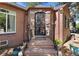 Ornate front door entrance with brick columns and stone steps at 2371 Locust St, Denver, CO 80207