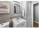 Well-appointed bathroom with a linen closet and updated fixtures at 2371 Locust St, Denver, CO 80207