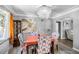 Dining room with hardwood floors, a chandelier, and an adjacent living room view at 2371 Locust St, Denver, CO 80207