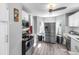 Modern kitchen with stainless steel appliances and white cabinets at 2371 Locust St, Denver, CO 80207