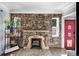 Stone fireplace with tiled hearth in living room at 2371 Locust St, Denver, CO 80207
