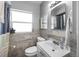 Clean bathroom with updated vanity and tiled shower/tub at 2371 Locust St, Denver, CO 80207