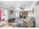 Living room with stone fireplace, hardwood floors, and lots of natural light at 2371 Locust St, Denver, CO 80207