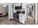 Updated kitchen with white cabinets and stainless steel appliances at 2371 Locust St, Denver, CO 80207