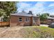 Brick home with a spacious backyard and detached garage at 2371 Locust St, Denver, CO 80207
