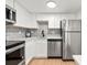 Modern kitchen with stainless steel appliances and white cabinetry at 17004 E Tennessee Dr # 210, Aurora, CO 80017