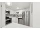 Modern kitchen with stainless steel appliances and white cabinetry at 17004 E Tennessee Dr # 210, Aurora, CO 80017