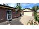 Brick home with security door and attached garage at 7820 Mccella Ct, Westminster, CO 80030