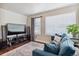 Bright living room featuring hardwood floors, large windows, and comfortable seating at 11590 S Maiden Hair Way, Parker, CO 80134