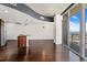 Bright living room with hardwood floors and large windows showcasing stunning city views at 891 14Th St # 3504, Denver, CO 80202