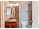 Well-lit bathroom with single vanity and tiled shower/tub combo at 3672 S Perth Cir # 101, Aurora, CO 80013