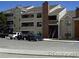 Exterior view of a multi-unit residential building with parking at 12093 W Cross Dr # 308, Littleton, CO 80127