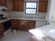 Kitchen with wooden cabinets and appliances at 12093 W Cross Dr # 308, Littleton, CO 80127