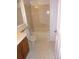 Main bathroom with a tub and wooden vanity at 12093 W Cross Dr # 308, Littleton, CO 80127