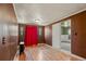 Bright living room featuring hardwood floors and a fireplace at 1219 Lilac Dr, Lochbuie, CO 80603