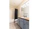 Bathroom with a tub, toilet, and light blue vanity at 10935 Acadia, Parker, CO 80138