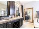 Large bathroom with double vanity and a soaking tub at 10935 Acadia, Parker, CO 80138