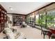 Bright library with built-in bookshelves, comfortable seating, and large windows at 7846 Village Rd, Parker, CO 80134