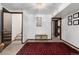 Basement hallway with tiled floor and access to other rooms at 7846 Village Rd, Parker, CO 80134
