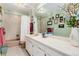 Bathroom with double vanity and shower/tub combo at 7846 Village Rd, Parker, CO 80134