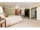 Main bedroom with garden views and a walk-in closet at 7846 Village Rd, Parker, CO 80134
