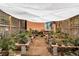 Relaxing outdoor bonsai garden with shade cover and various plants at 7846 Village Rd, Parker, CO 80134