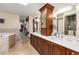 Primary bathroom with double vanity and walk-in shower at 7846 Village Rd, Parker, CO 80134