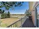 Deck overlooking expansive backyard and distant landscape at 7846 Village Rd, Parker, CO 80134