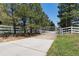 White metal gate leading to a ranch property at 7846 Village Rd, Parker, CO 80134